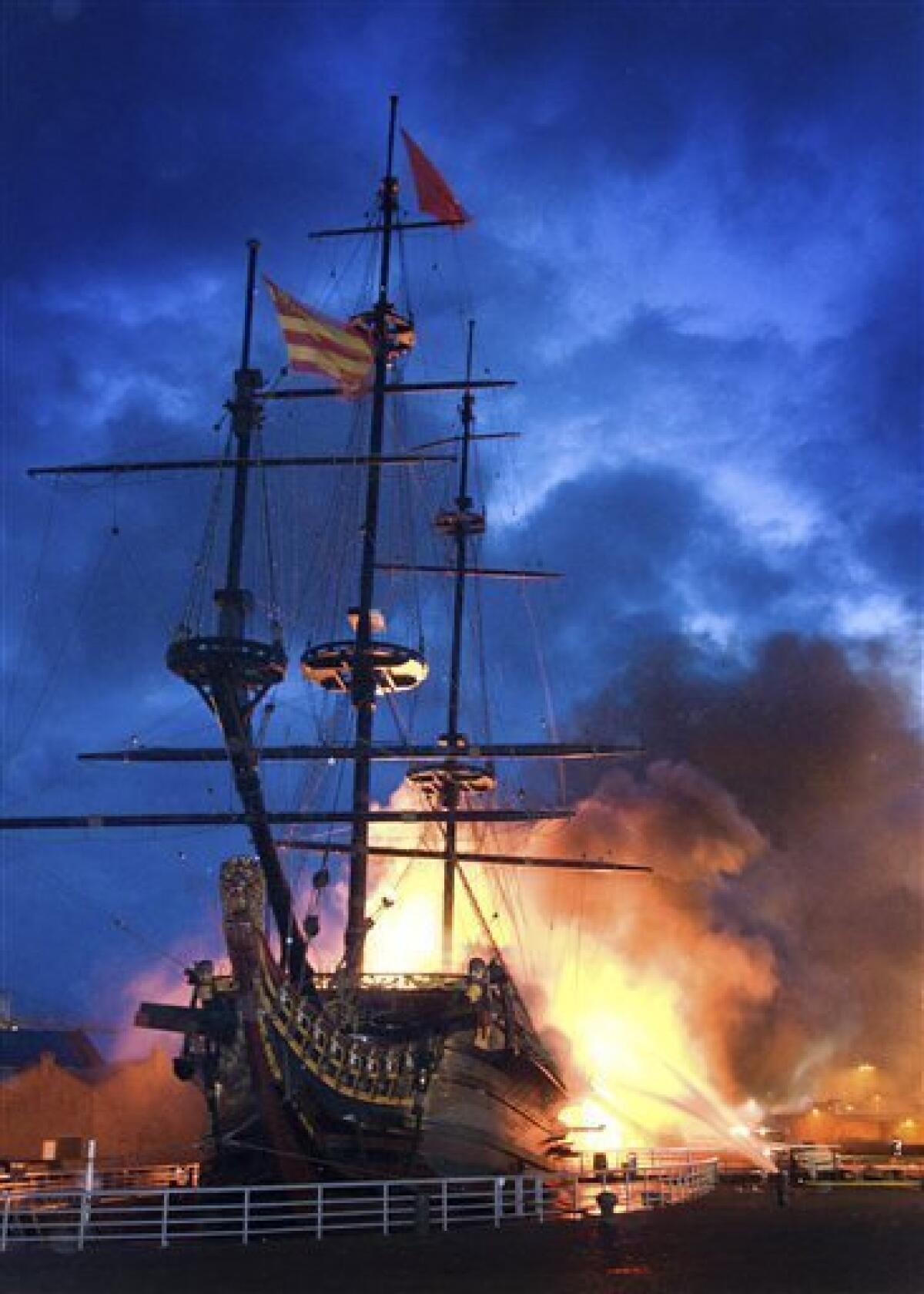 Flames consume a replica of the 17th-century flagship Prins Willem in Den Helder, northern Netherlands, early Thursday, July 30, 2009. Fire has destroyed a replica of the 17th-century flagship of the Dutch East India Company. The three-mast tall ship, which was built in the 1980s, was moored at Holland Village in Nagasaki, Japan, for many years before it returned to the northern Dutch port of Den Helder in 2003. (AP Photo/ Peter van Aalst/ Berber van Beek)
