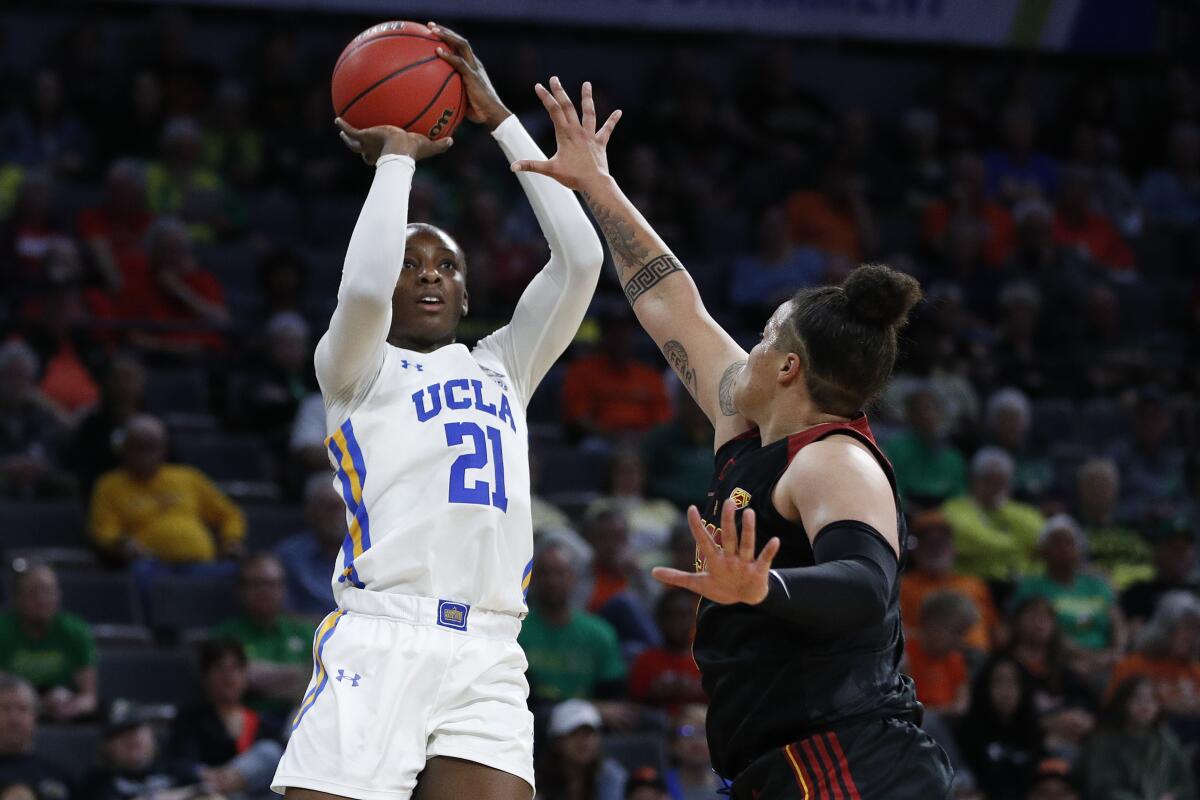 UCLA's Michaela Onyenwere shoots over USC's Kayla Overbeck during a Pac-12 women's tournament quarterfinal game March 6, 2020, in Las Vegas.