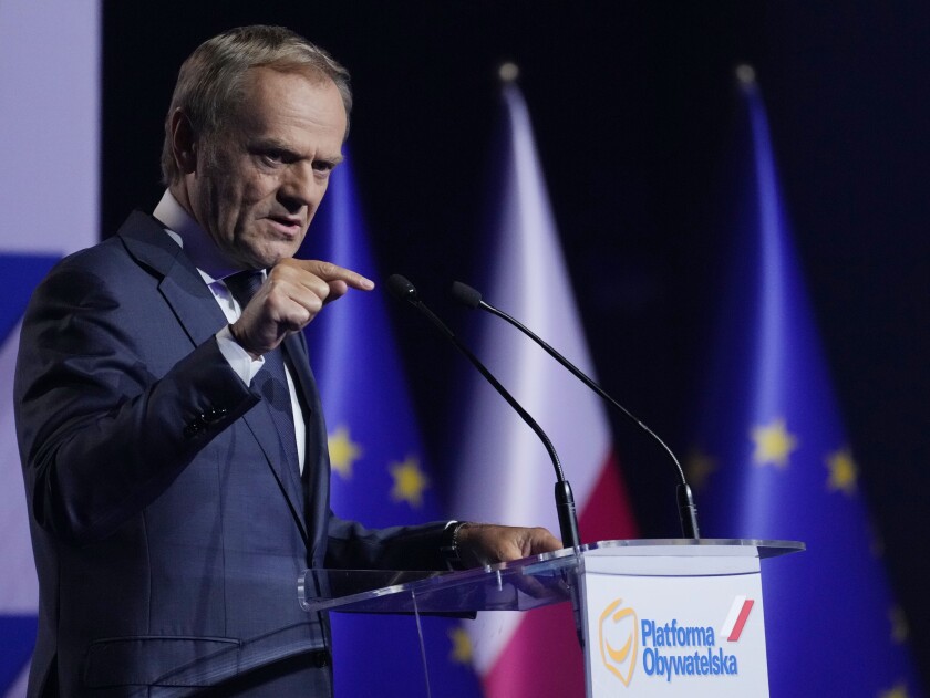 Former European Union leader and Poland's ex-prime minister, Donald Tusk, tells a congress of Poland's opposition Civic Platform party that he is returning to Poland's politics to help fight the "evil" that is ruling there now under the right-wing government of Law and Justice party, in Warsaw, Poland, Saturday, July 3, 2021.(AP Photo/Czarek Sokolowski)