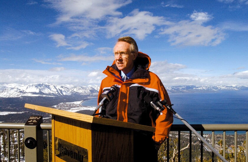 Harry Reid addresses the media at Heavenly Ski Resort overlooking Lake Tahoe in February 2002.