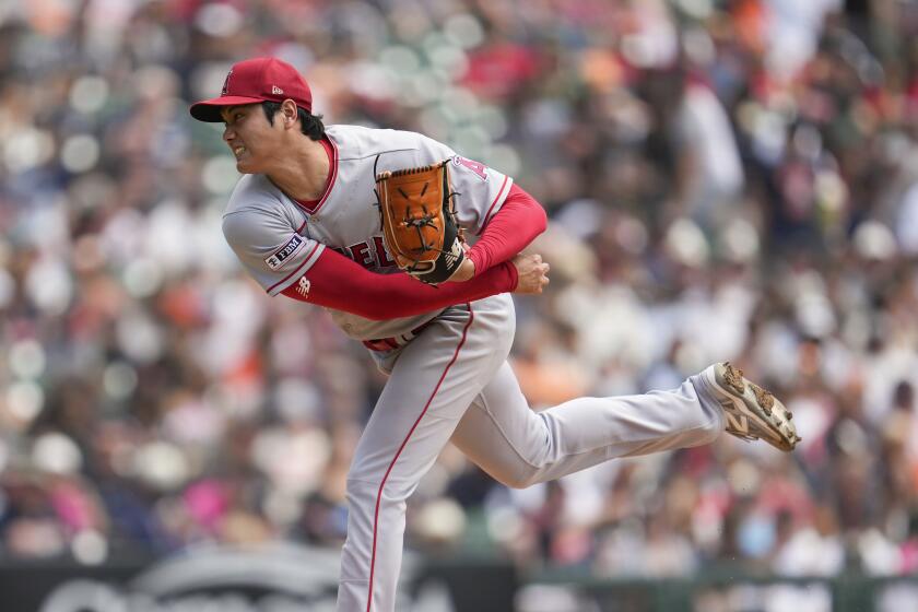 Los Angeles Angels pitcher Shohei Ohtani throws against the Detroit Tigers in the third inning during the first baseball game of a doubleheader, Thursday, July 27, 2023, in Detroit. (AP Photo/Paul Sancya)