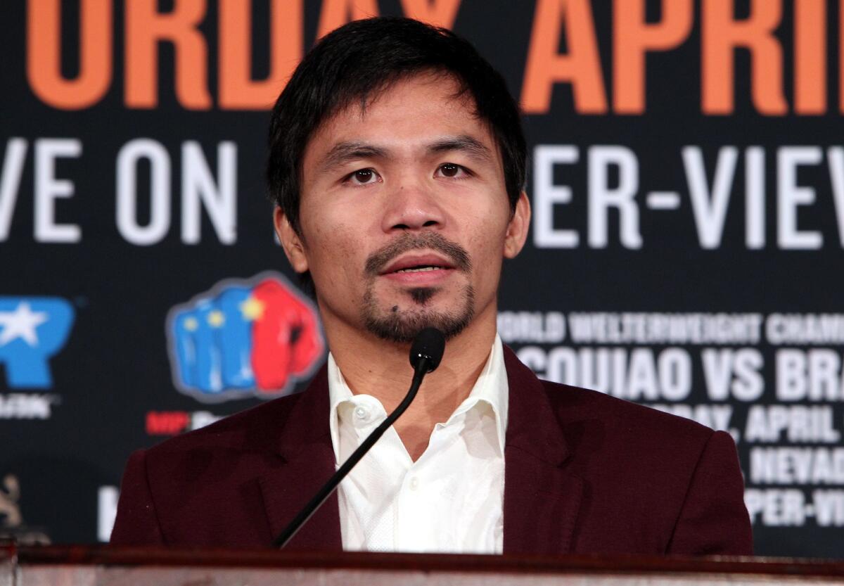 Manny Pacquiao speaks during a news conference at the Beverly Hills Hotel on Jan. 19.