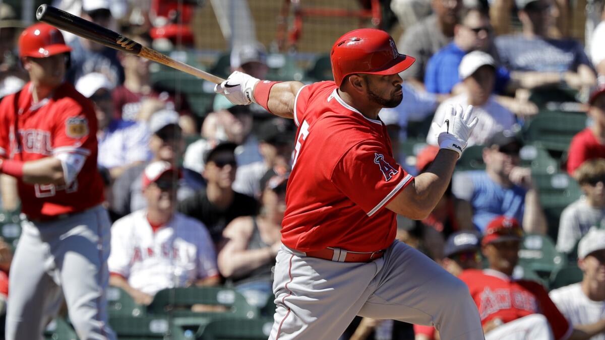Angels slugger Albert Pujols, shown during a game Thursday, had two hits Saturday against the Rockies in a Cactus League game.