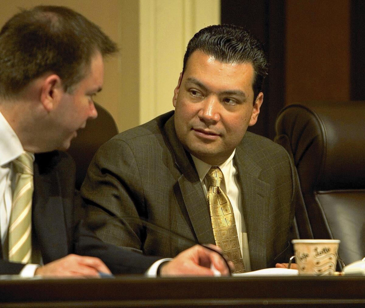 State Sen. Alex Padilla (D–Pacoima), right, is proposing a measure that would make it illegal for grocery stores and restaurants to sell mislabeled seafood.