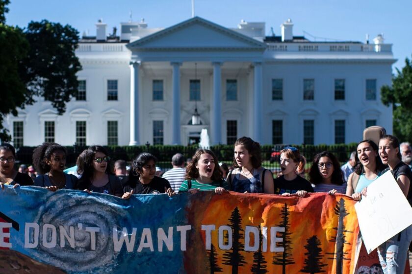 A group of teenage protesters, part of the global movement "Fridays for Future" against climate change, gather in front of the White House in Washington DC on May 24, 2019. - While many previous protest movements have started on university campuses, the "Fridays" rallies emerged from among school students -- a generation that has grown up with predictions of ecological doom yet witnessed what they see as only glacial political change. (Photo by Eric BARADAT / AFP)ERIC BARADAT/AFP/Getty Images ** OUTS - ELSENT, FPG, CM - OUTS * NM, PH, VA if sourced by CT, LA or MoD **
