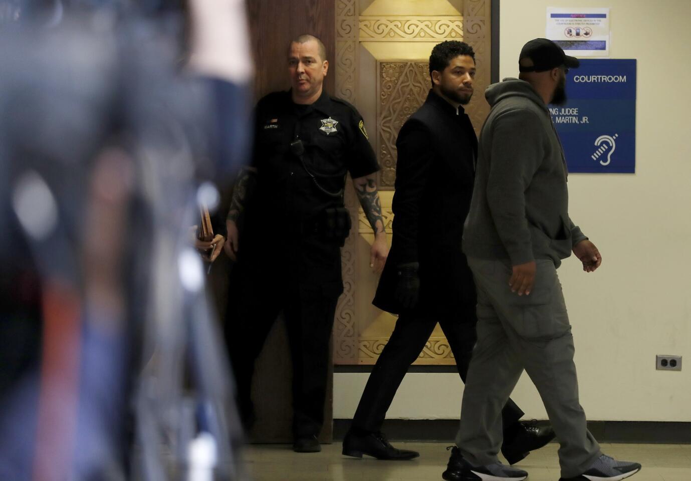 Actor Jussie Smollett exits courtroom 101 into the hallway inside the Leighton Criminal Court Building following an emergency hearing for his disorderly conduct charges, March 26, 2019.