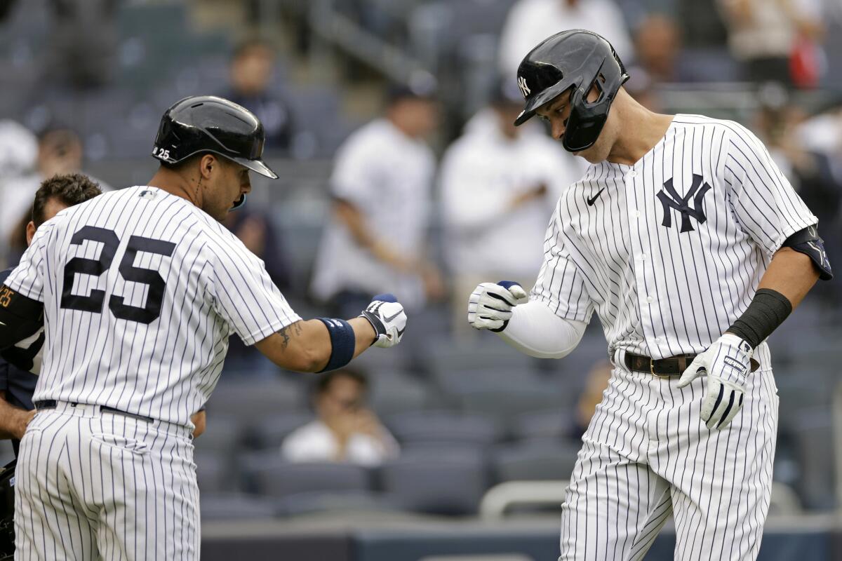 New York Yankees' Aaron Judge celebrates a with Gleyber Torres (25) after hitting a home run during the fourth inning of the first baseball game of a doubleheader against the Minnesota Twins on Wednesday, Sept. 7, 2022, in New York. (AP Photo/Adam Hunger)