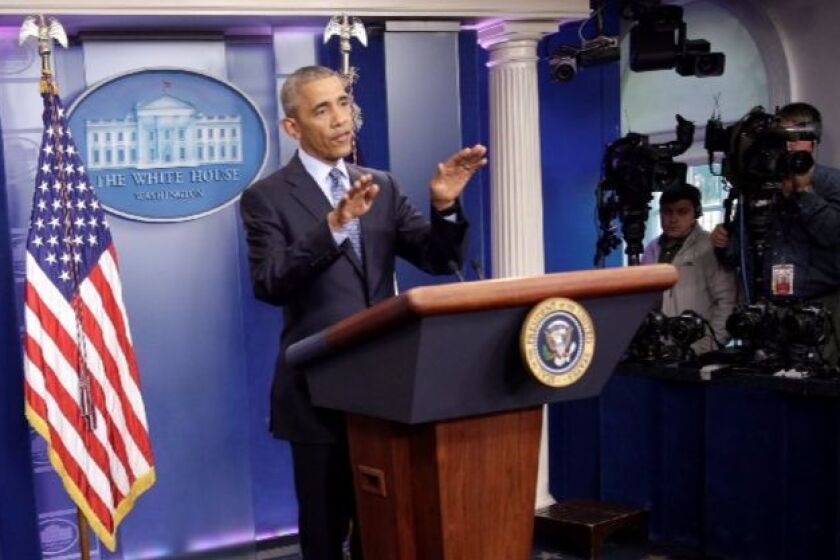 President Obama gestures Wednesday during his final news conference as the nation's leader.