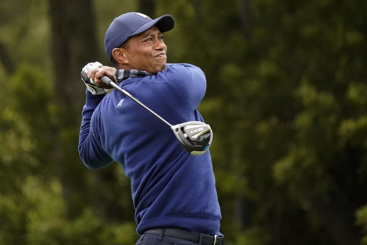 Tiger Woods watches his tee shot on the 12th hole during the first round of the PGA Championship golf tournament at TPC Harding Park Thursday, Aug. 6, 2020, in San Francisco. (AP Photo/Jeff Chiu)