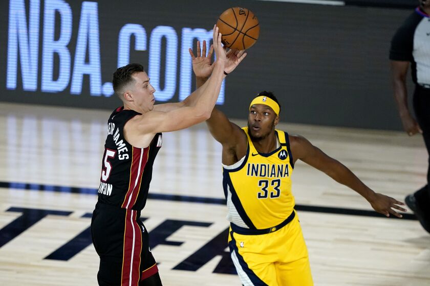 Miami Heat's Duncan Robinson shoots as Indiana Pacers' Myles Turner (33) defends during the first half of an NBA basketball first round playoff game, Thursday, Aug. 20, 2020, in Lake Buena Vista, Fla. (AP Photo/Ashley Landis, Pool)