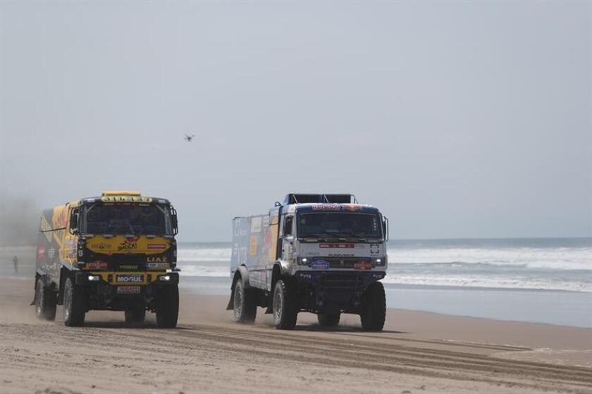 Russia's Andrey Karginov (right) drives his Kamaz truck alongside the Czech Republic's Martin Mack on Jan. 11, 2019, during the fifth stage of the 2019 Dakar Rally between Tacna and Arequipa, Peru. EPA-EFE/Ernesto Arias