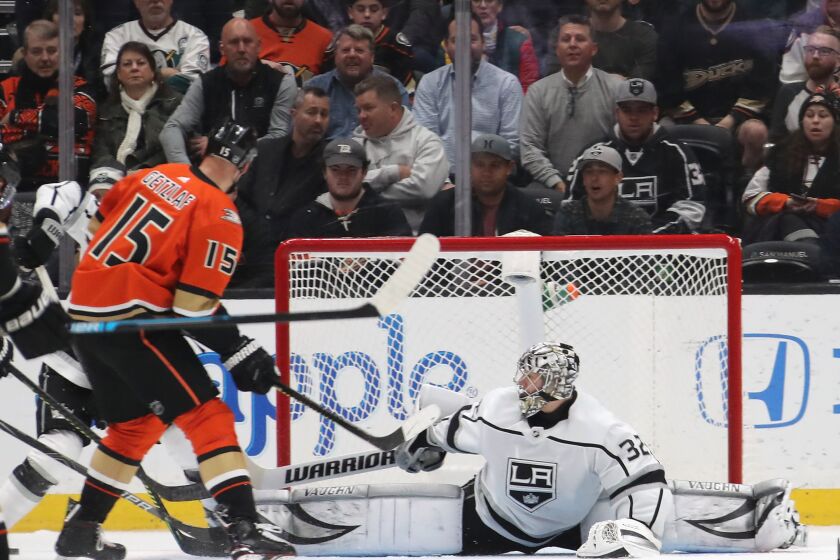 ANAHEIM, CALIFORNIA - DECEMBER 12: Jonathan Quick #32 of the Los Angeles Kings defends the net against Ryan Getzlaf #15 of the Anaheim Ducks during the second period at the Honda Center on December 12, 2019 in Anaheim, California. (Photo by Bruce Bennett/Getty Images) ** OUTS - ELSENT, FPG, CM - OUTS * NM, PH, VA if sourced by CT, LA or MoD **
