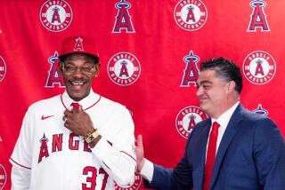 Angeles general manager Perry Minasian, right, and manager Ron Washington speak during a news conference on Nov. 15, 2023.