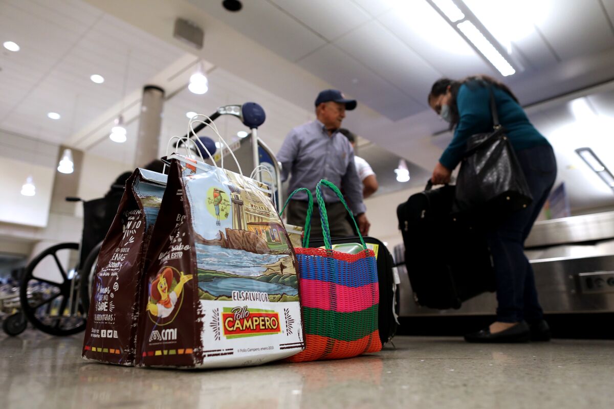 A bag from Pollo Campero at airport baggage claim.