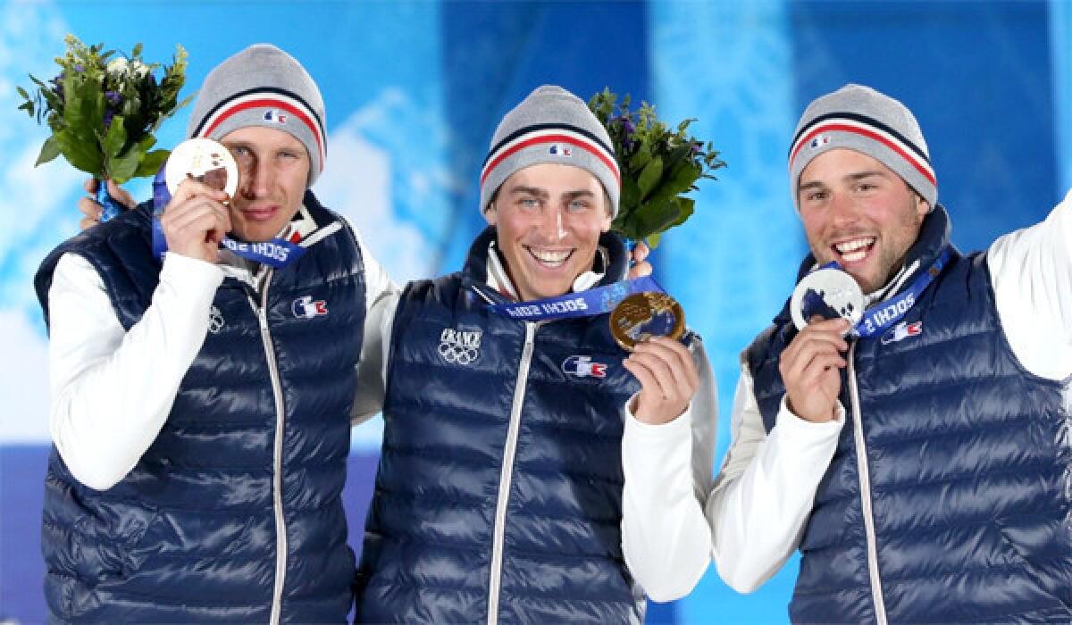 Bronze medalist Jonathan Midol, left, gold medalist Jean Frederic Chapuis, center, and silver medalist Arnaud Bovolenta, right, swept the men's freestyle ski cross event for France on Thursday.