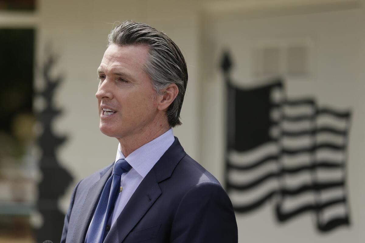 California Governor Gavin Newsom speaks during a news conference.