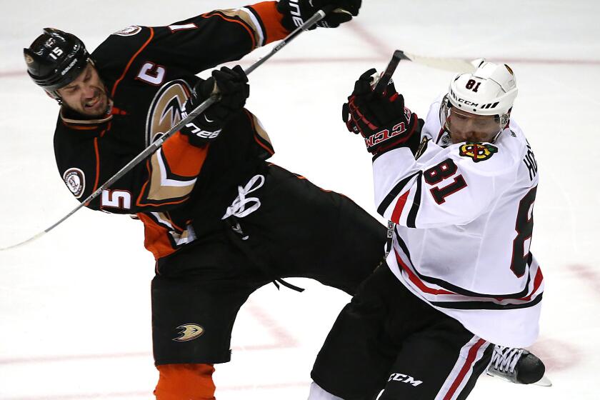 Ducks captain Ryan Getzlaf, left, collides with Chicago Blackhawks forward Marian Hossa during the Ducks' victory in Game 1 of the Western Conference finals in May.