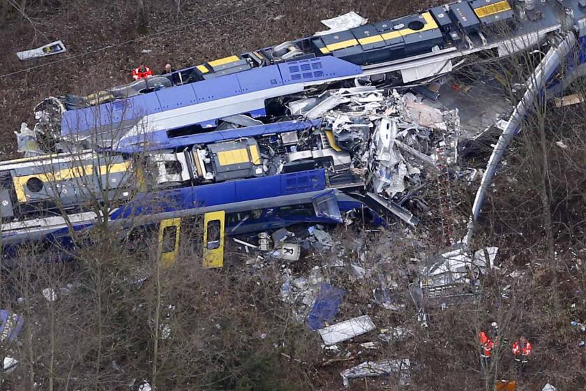 Rescue teams work at the site where two trains collided head-on near Bad Aibling, Germany, on Feb. 9.