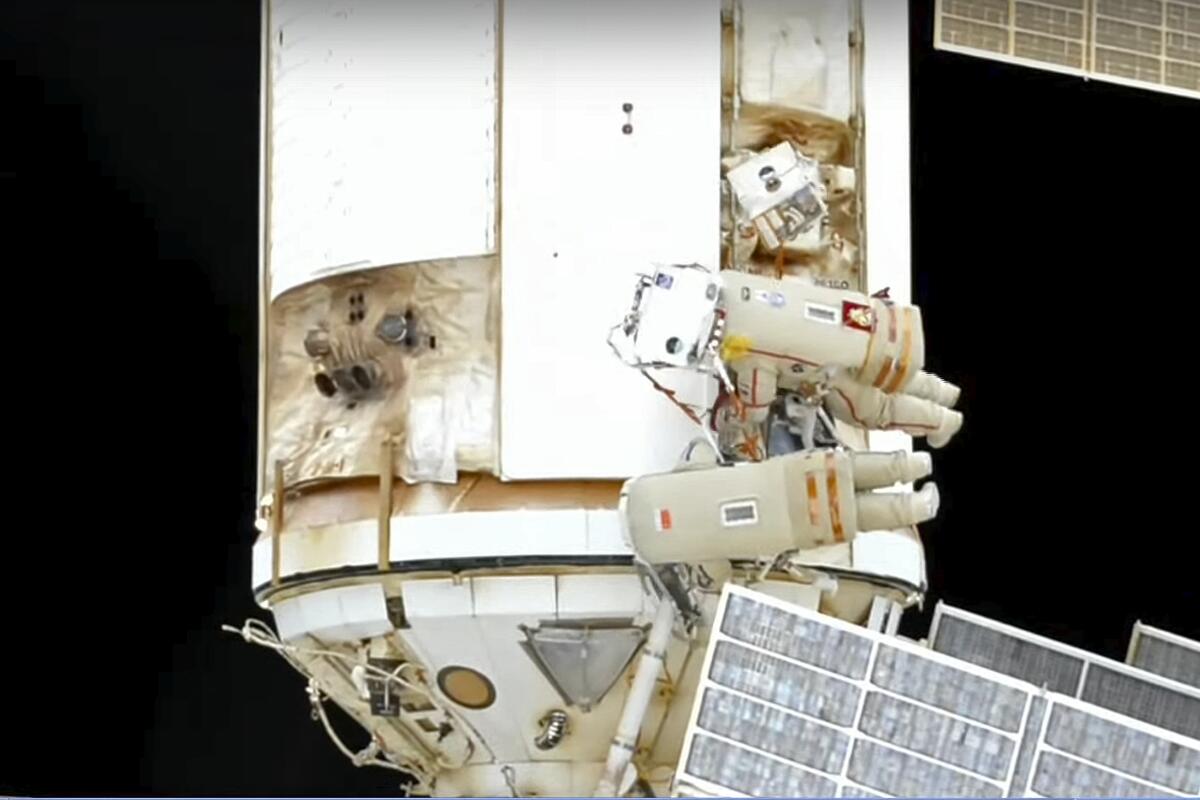 In this photo taken from video footage released by Roscosmos Space Agency, Roscosmos' cosmonauts Oleg Artemyev and Denis Matveev are seen during their spacewalk on the International Space Station (ISS), Wednesday, Aug. 17, 2022. Roscosmos' cosmonauts Oleg Artemyev and Denis Matveev make a spacewalk at the space station to continue installation work of the European Space Agency's robot arm on the new Russian lab. (Roscosmos Space Agency via AP)