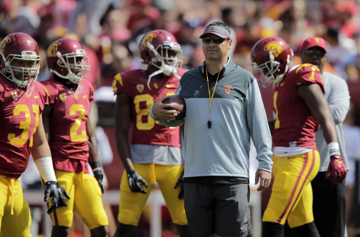 USC Coach Steve Sarkisian oversees the offense before the annual spring game at the Coliseum on April 11, 2015.