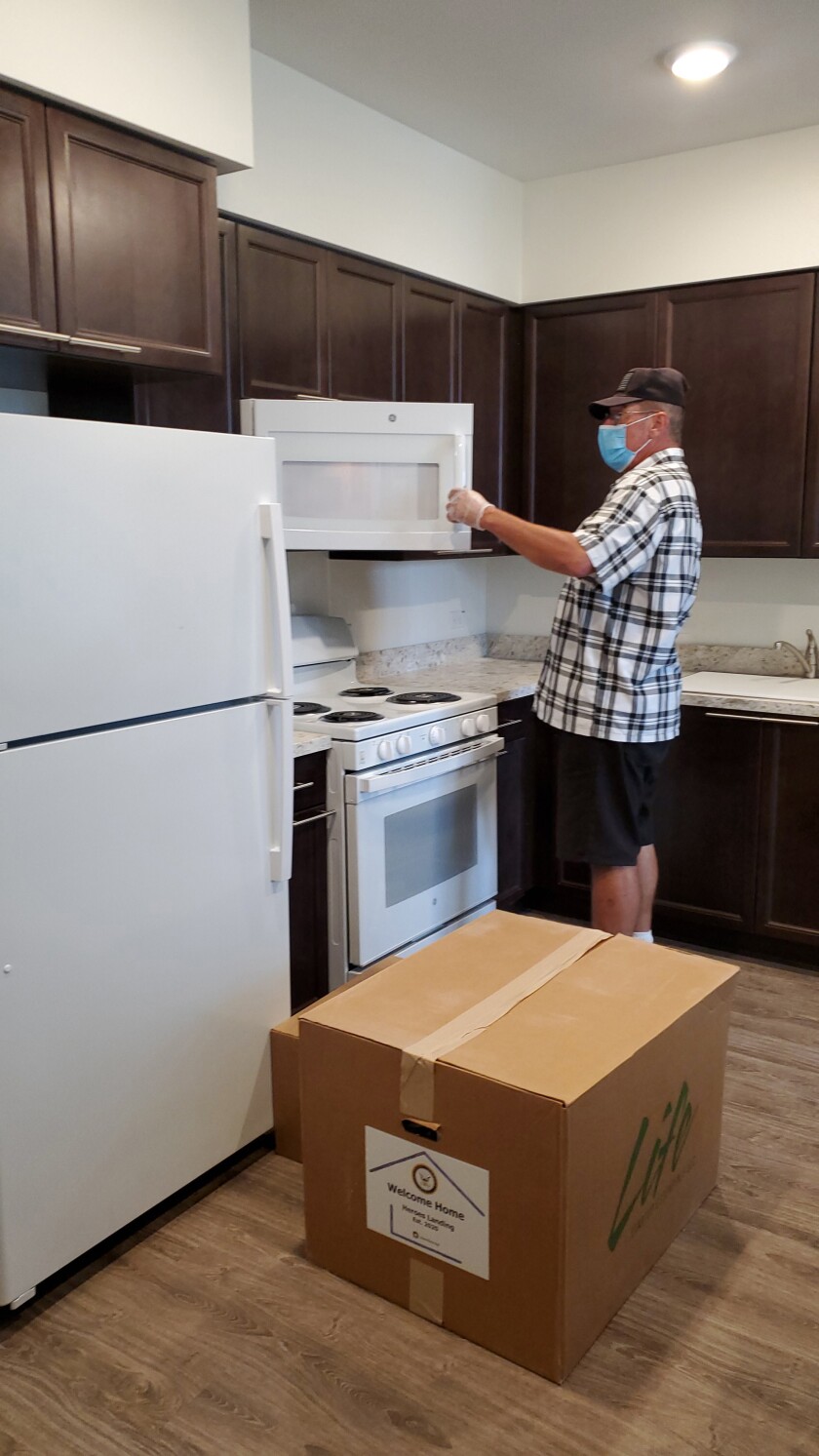 A formerly homeless veteran moves into his new apartment at Jamboree's Heroes Landing in Santa Ana.