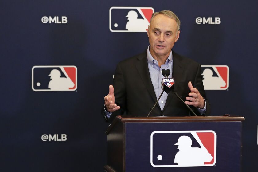 Rob Manfred, commissioner of Major League Baseball, speaks during a news conference at owners meetings Friday, Feb. 8, 2019, in Orlando, Fla. (AP Photo/John Raoux)