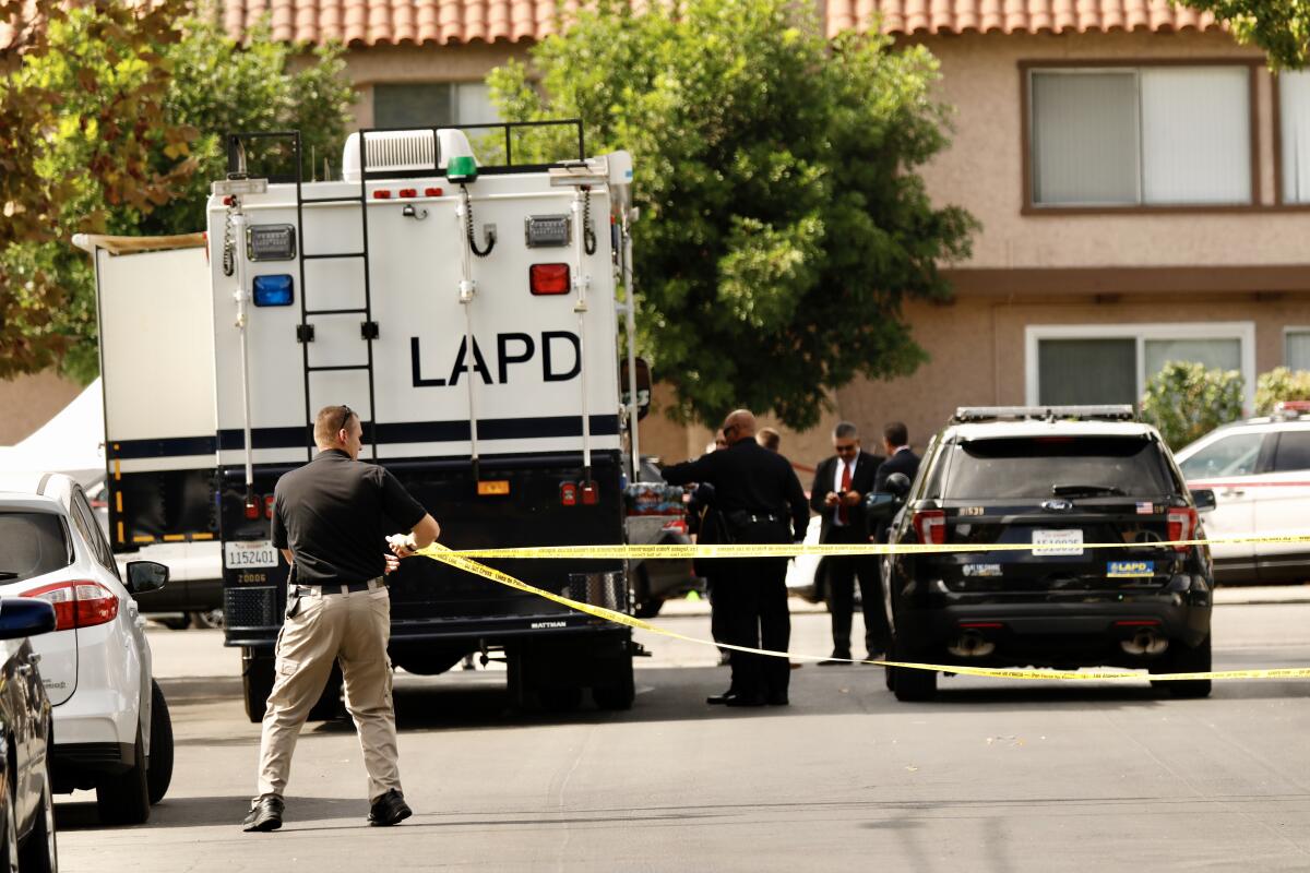 Police investigate the scene of a fatal police shooting in Sherman Oaks in 2019.