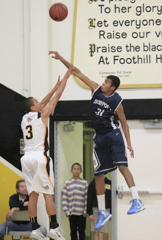 Newport Harbor High's Brandon Phillips (31) blocks a shot by Foothill's Josh Gonzalez (3) during the first half in a CIF Southern Section Division 2AA first-round playoff game on Friday.