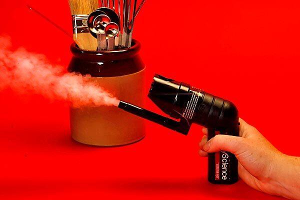 A hand-held smoker by PolyScience allows for finishing foods with cool smoke.