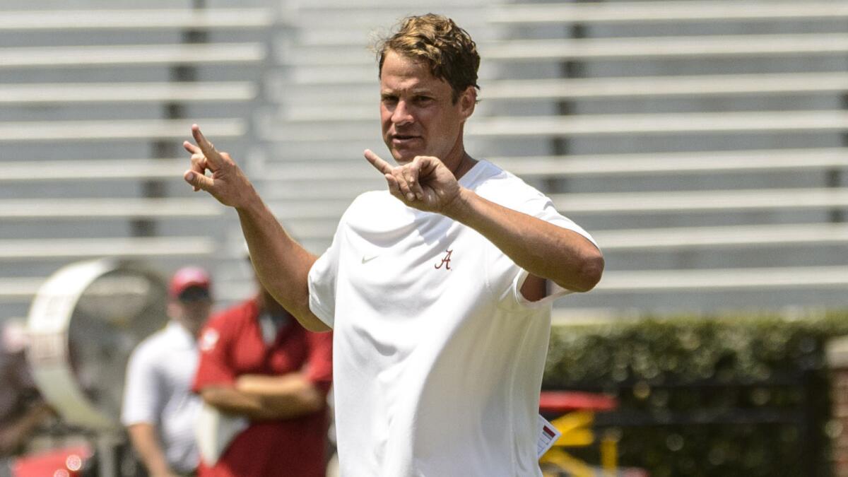 Alabama offensive coordinator Lane Kiffin works with his players during a team practice session on Aug. 16.