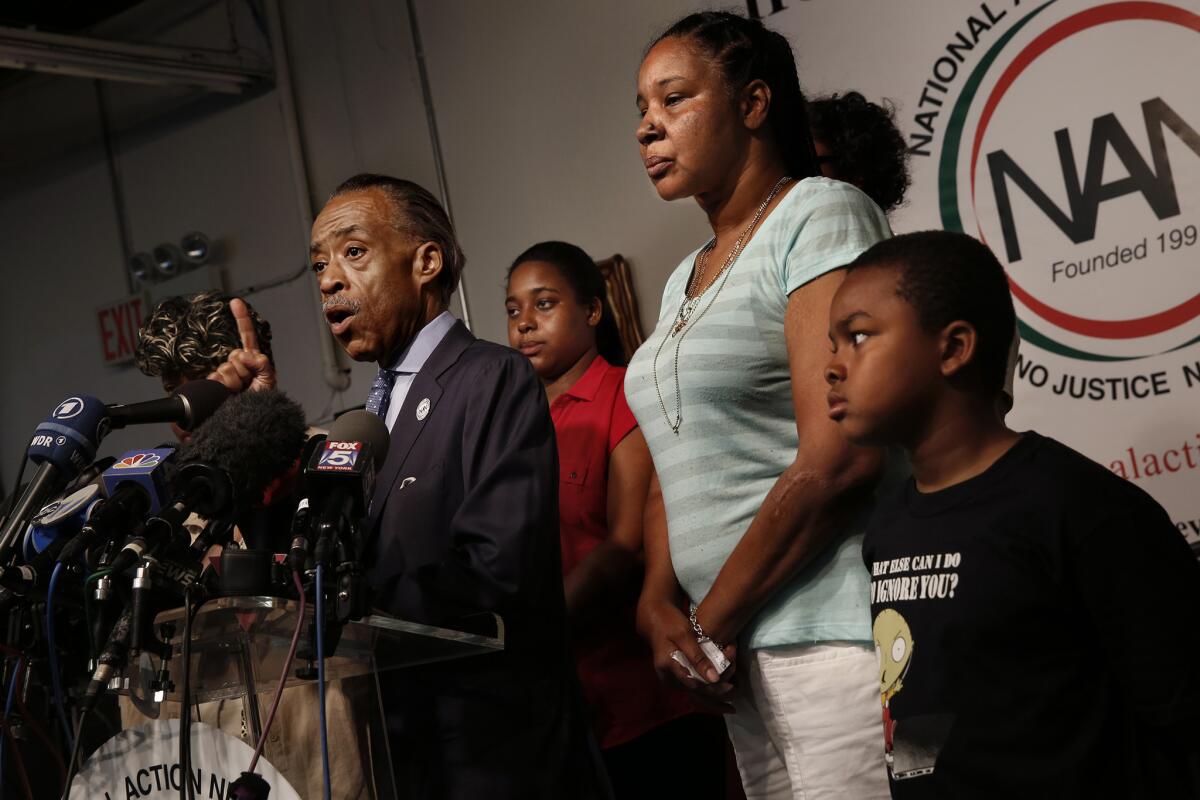 Rev. Al Sharpton, along with the family of Eric Garner, who died in police custody last year, spoke to the press at the National Action Network office in New York. Sharpton is hosting a rally Saturday to call for justice for Garner and to change the name of a Confederate street at Fort Hamilton in Brooklyn.
