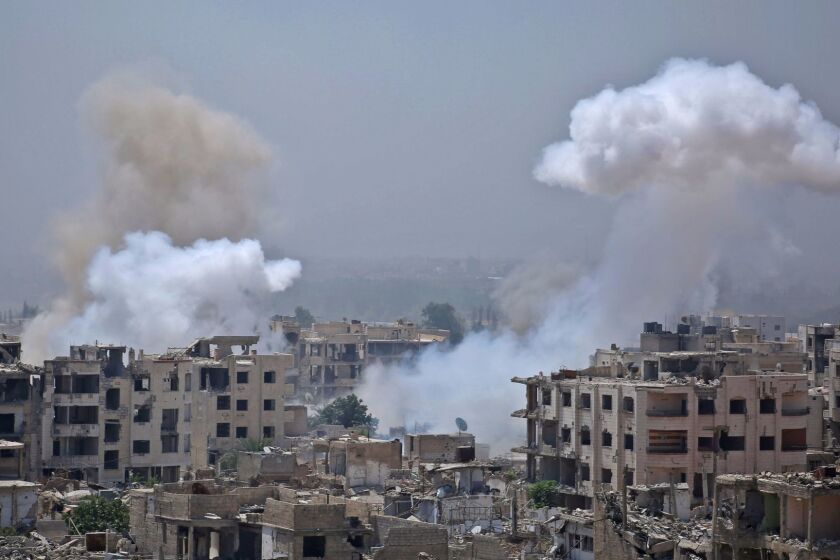 Smoke billows following a reported air strike by Syrian government forces in the rebel-held parts of the Jobar district, on the eastern outskirts of the Syrian capital Damascus, on August 9, 2017. / AFP PHOTO / Ammar SULEIMANAMMAR SULEIMAN/AFP/Getty Images ** OUTS - ELSENT, FPG, CM - OUTS * NM, PH, VA if sourced by CT, LA or MoD **