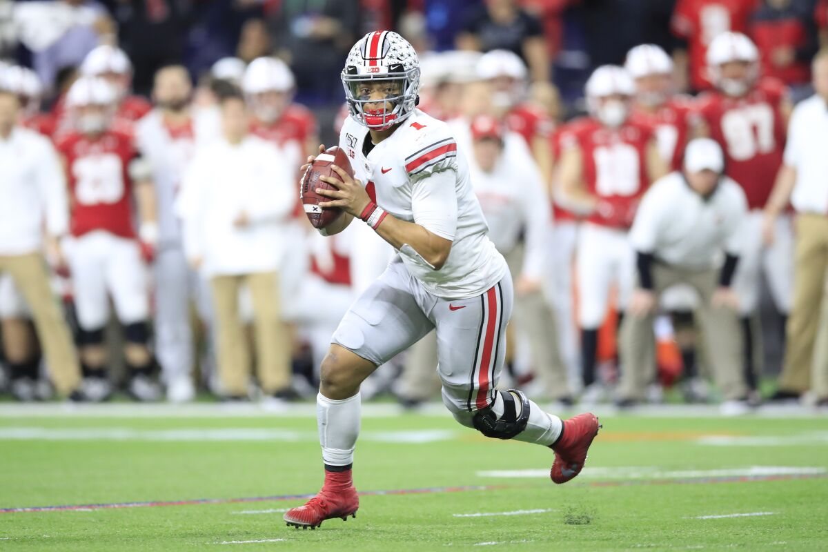 Ohio State quarterback Justin Fields looks to pass in his team's 34-21 win in the Big Ten title game Dec. 7, 2019.