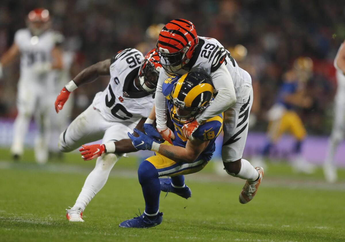 Rams wide receiver Cooper Kupp is tackled by Bengals cornerback Tony McRae during the second half. 