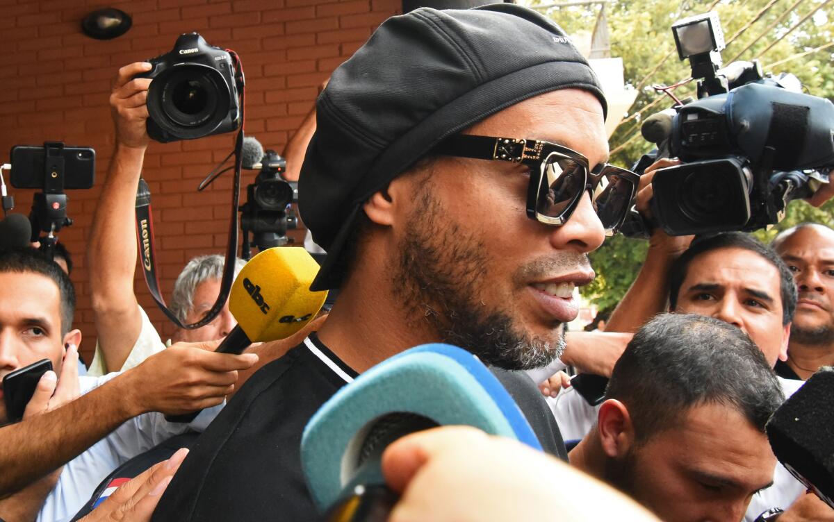 Brazilian retired football player Ronaldinho leaves Asuncion's Prosecution after declaring about his irregular entry to the country, in Asuncion, Paraguay, on March 5, 2020. - Former Brazilian football star Ronaldinho and his brother have been detained in Paraguay after allegedly using fake passports to enter the South American country, authorities said Wednesday. (Photo by NORBERTO DUARTE / AFP) (Photo by NORBERTO DUARTE/AFP via Getty Images)