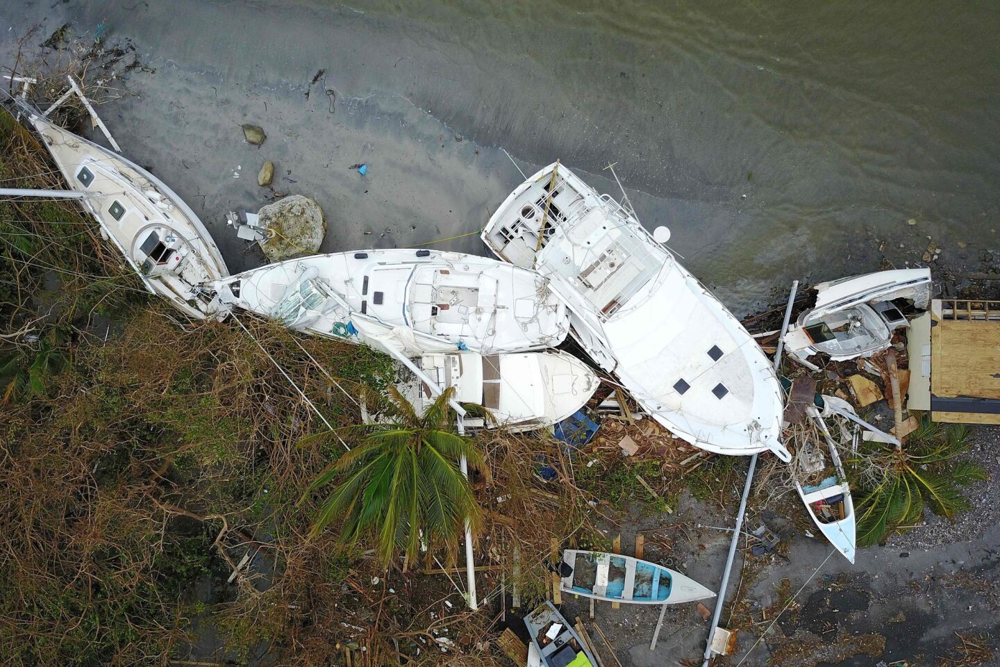 Damaged sailboats washed ashore are seen in the aftermath of Hurricane Maria in Fajardo, Puerto Rico.
