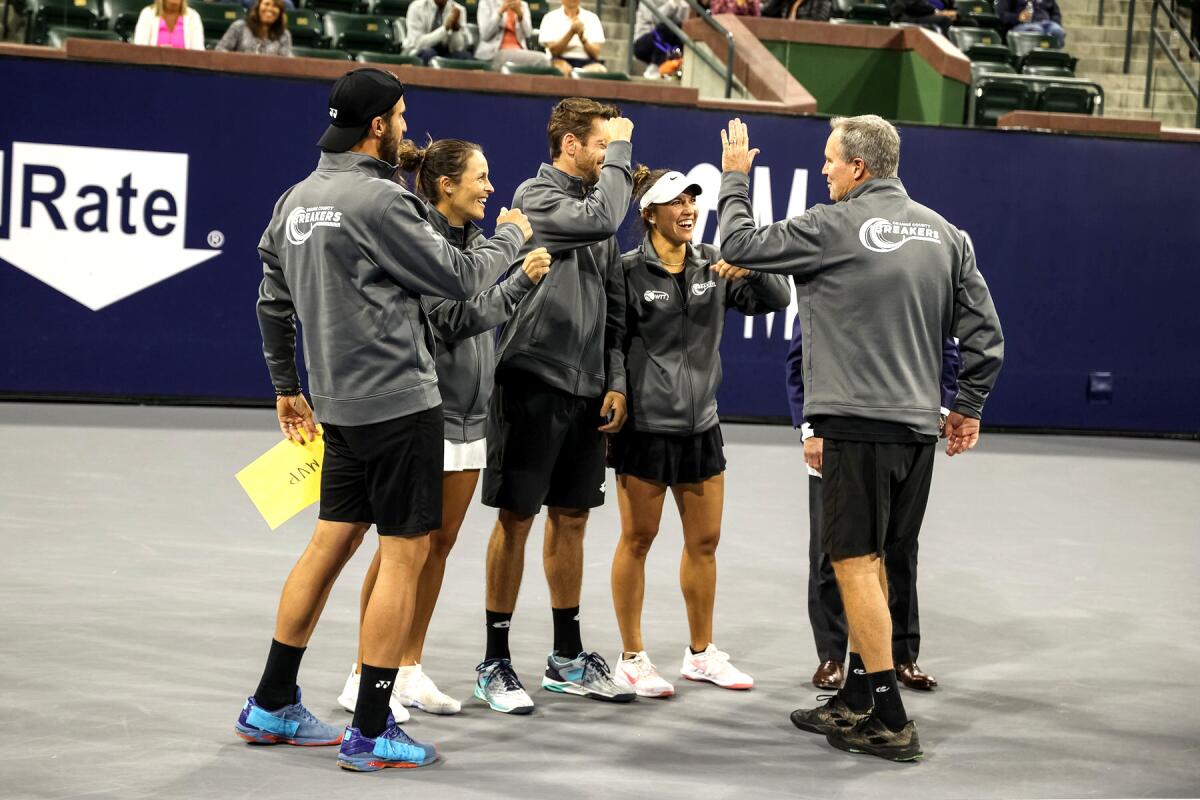 Orange County Breakers players celebrate after winning the title Sunday at Indian Wells Tennis Garden.