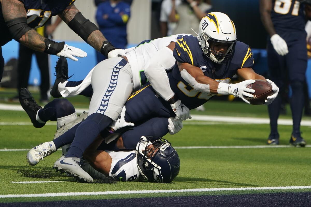 Chargers running back Austin Ekeler dives into the end zone to score a touchdown in the second quarter.
