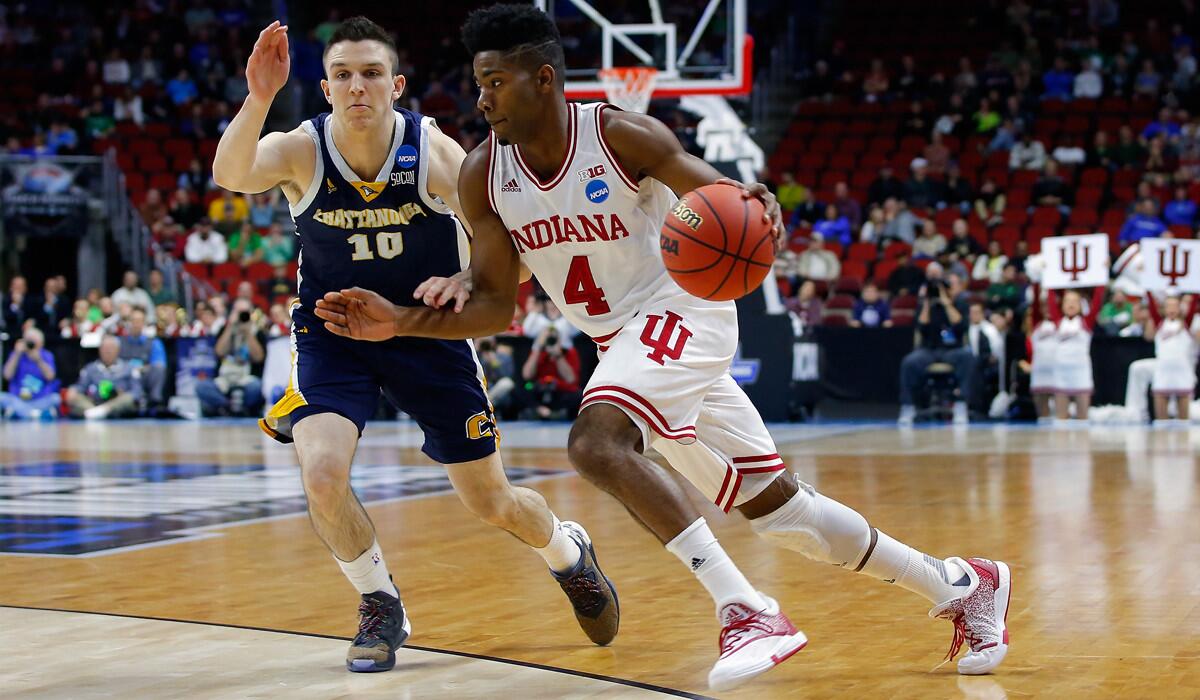 Indiana's Robert Johnson drives against Chattanooga's Peyton Woods in the first half of the first round of the 2016 NCAA Men's Basketball Tournament at Wells Fargo Arena on Thursday in Des Moines, Iowa.