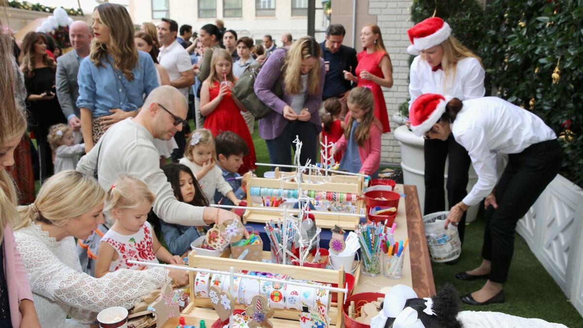 The ornament-decorating station was one of several festive activities at the fifth annual holiday party fundraiser that has helped Brooks Brothers raise nearly $18.5 million to benefit St. Jude Children's Research Hospital since 2005.