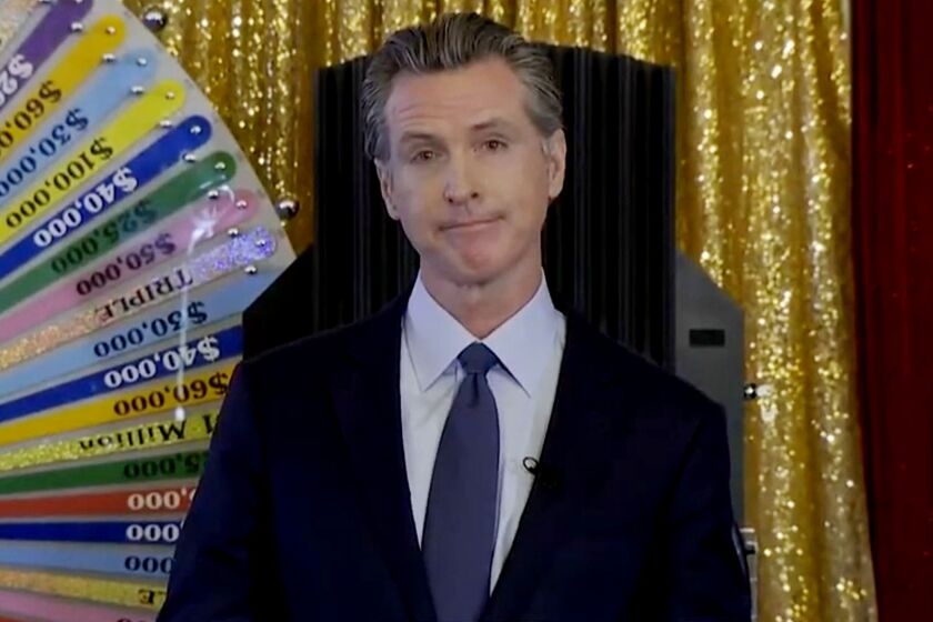 Gov. Gavin Newsom, facing a recall election, draws the names of the first winners of California's COVID-19 vaccine lottery in an upbeat event.