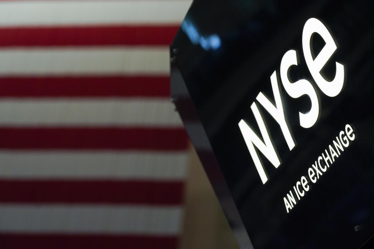A NYSE sign is seen on the floor at the New York Stock Exchange.