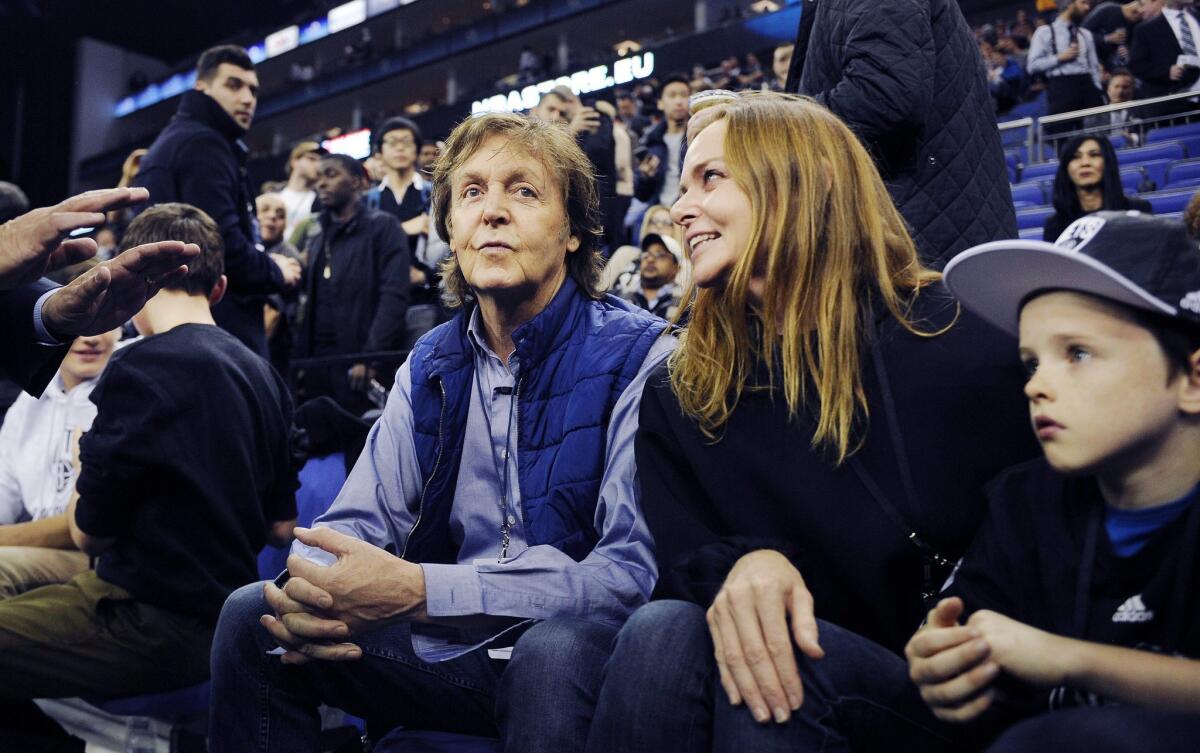 Paul McCartney and daughter Stella attend an Atlanta Hawks-Brooklyn Nets basketball game in London.