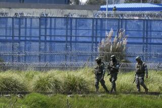 Soldiers enter the prison in Cotopaxi, Ecuador, Sunday, Jan. 14, 2024. Soldiers and police intervened on Sunday in several prisons in Ecuador in search of weapons, ammunition and explosives and to restore order. (AP Photo/Dolores Ochoa)