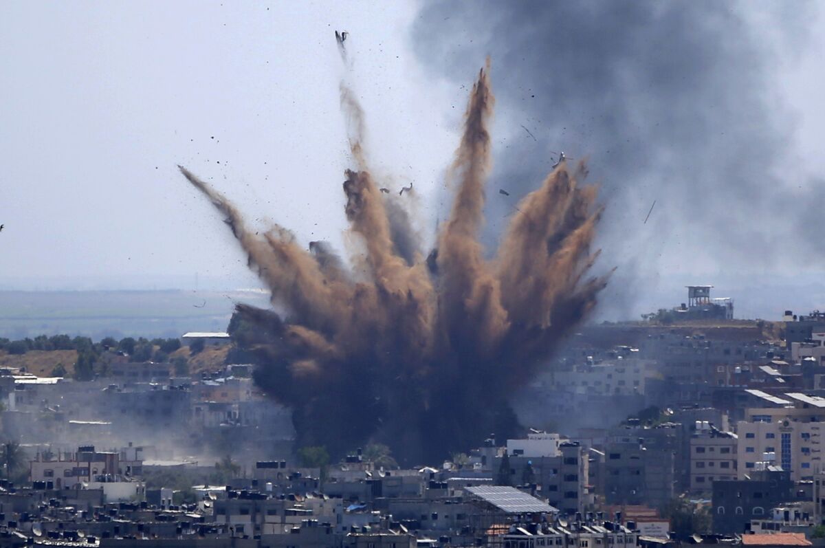 FILE - A blast from an Israeli airstrike on a building in Gaza City throws dust and debris on May 13, 2021, as Hamas and Israel traded more rockets and airstrikes and Jewish-Arab violence raged across Israel at the end of the Muslim holy month of Ramadan. (AP Photo/Hatem Moussa, File)