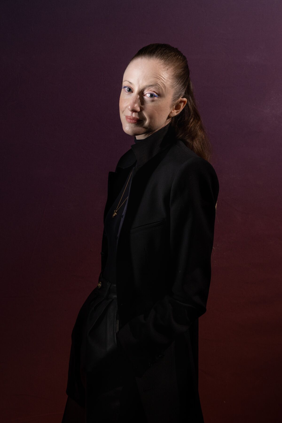 Andrea Riseborough wears all black for a portrait.