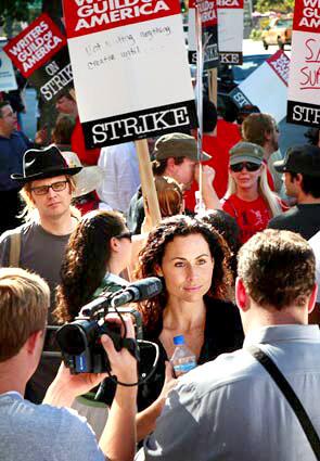 As TV and movie writers in New York set up picket lines with Wall Street as a symbolic backdrop, protesters back in Los Angeles continued to come out in force -- and actors made their sympathies known. Outside Universal Studios, Minnie Driver speaks to the media after a turn on the lines.