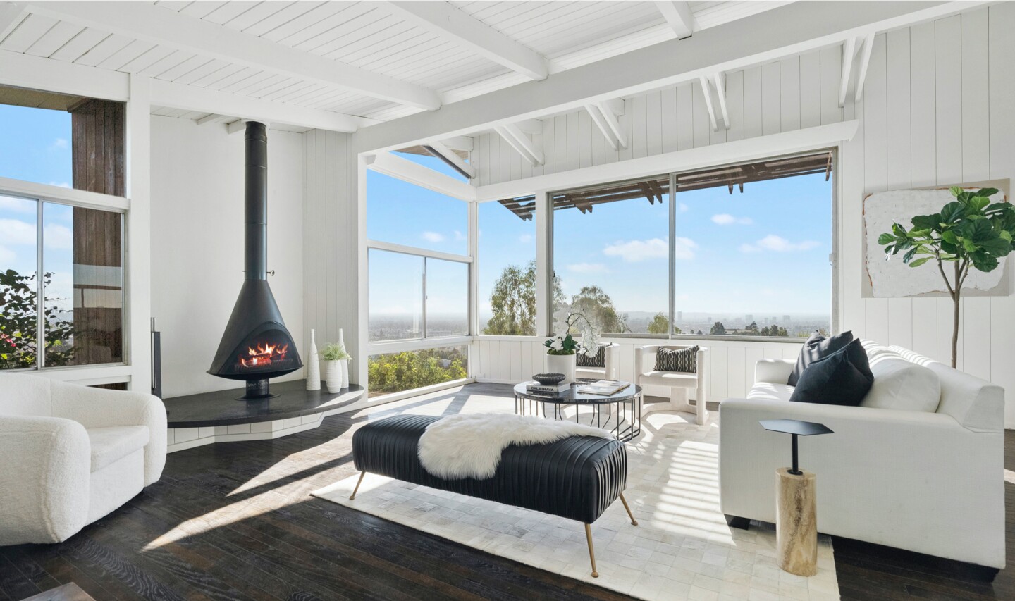 Built in 1951, the Midcentury post-and-beam features an eye-catching exterior of wood and glass.