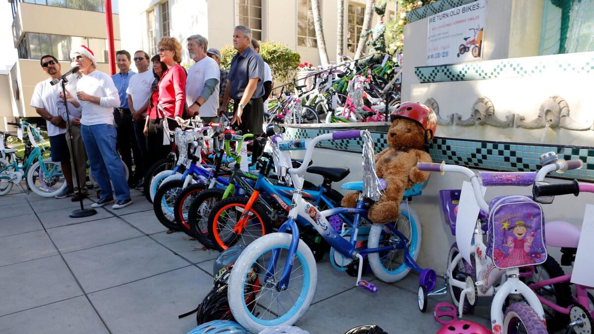 Dozens of bikes were displayed during annual Burbank Bike Angels press conference, in front of City Hall in Burbank on Wednesday, Dec. 13, 2017. Bike Angels collects used bikes throughout the year and restores them to give away to needy children during Christmas.