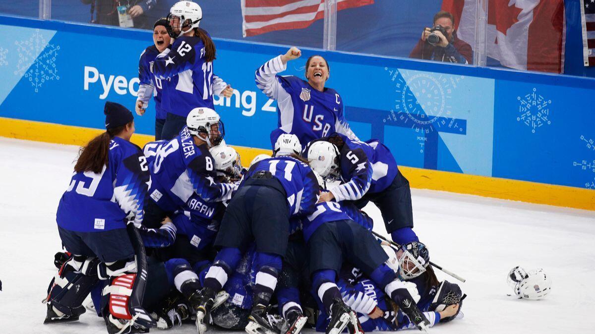 United States celebrates winning the women's gold medal hockey game against Canada at the 2018 Winter Olympics on Thursday.